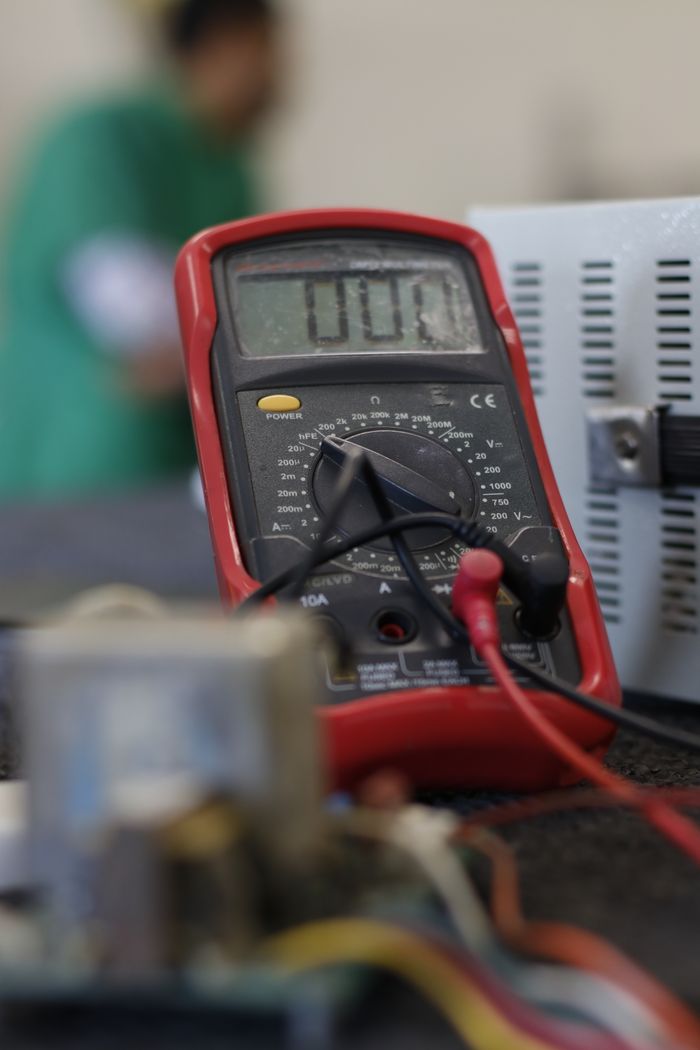 Crafting Captivating Headlines: Your awesome post title goes here Close-up shot of a multimeter used for electrical measurements, with focus on the display.